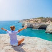 Female tourist overlooking coast in the Algarve