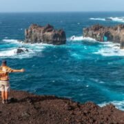 Young Man Taking A Picture At A Cliff In El Hierro, Canary Islands, Spain