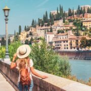 Woman looking at Castel San Pietro in Verona on a beautiful summer day